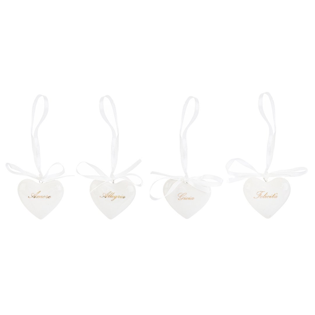 56405 Calamita cuore in porcellana in 4 modelli assortiti Calamita a cuore in porcellana bianca in quattro modelli assortiti